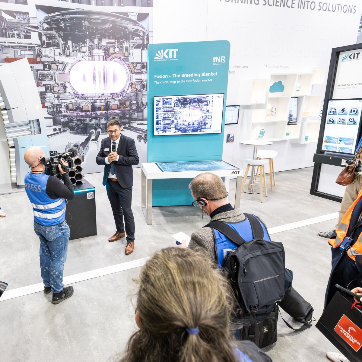 Professor Christoph Kirchlechner presents recent fusion research at Hannover Messer.